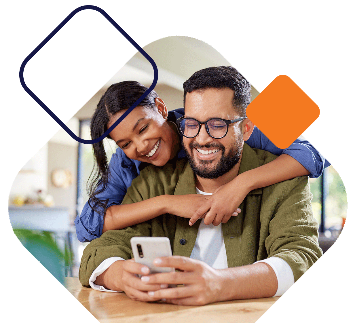 SmilingCoupleViewingPhone