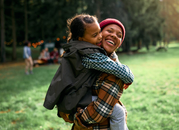 Smiling Mom And Daughter