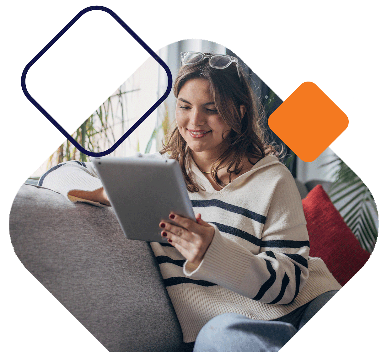 Woman Sitting On Couch Looking At iPad
